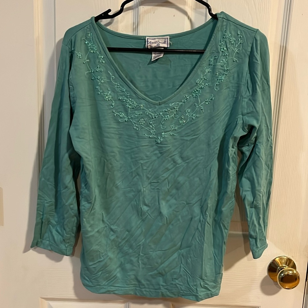 I meant long sleeve T-shirt with embroidery with beads around the neck